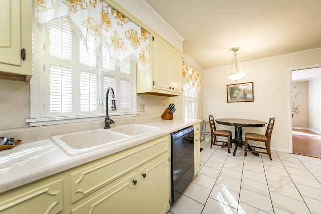 kitchen featuring sink, crown molding, dishwasher, and pendant lighting