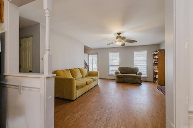 unfurnished living room with ceiling fan and hardwood / wood-style floors