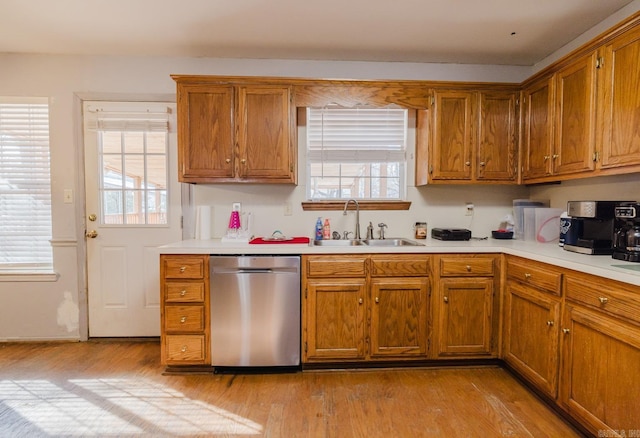 kitchen with sink, light hardwood / wood-style flooring, and dishwasher