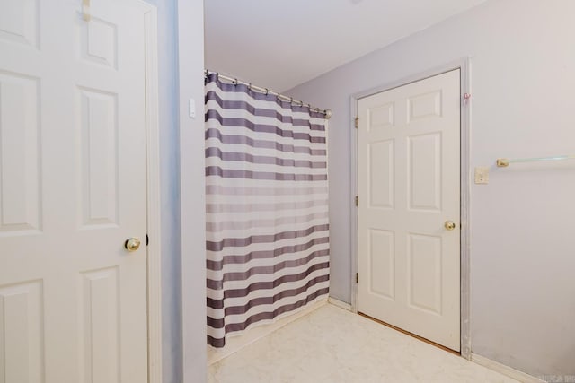 bathroom with a shower with curtain