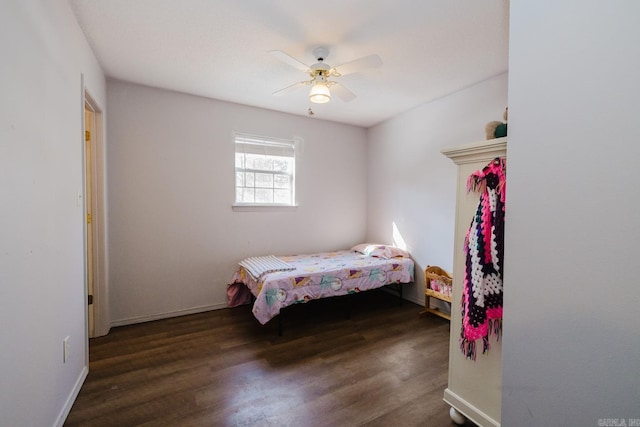 bedroom with dark wood-type flooring and ceiling fan