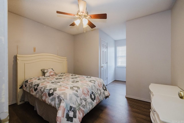 bedroom featuring dark hardwood / wood-style flooring and ceiling fan