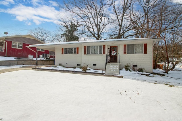 ranch-style home featuring central AC