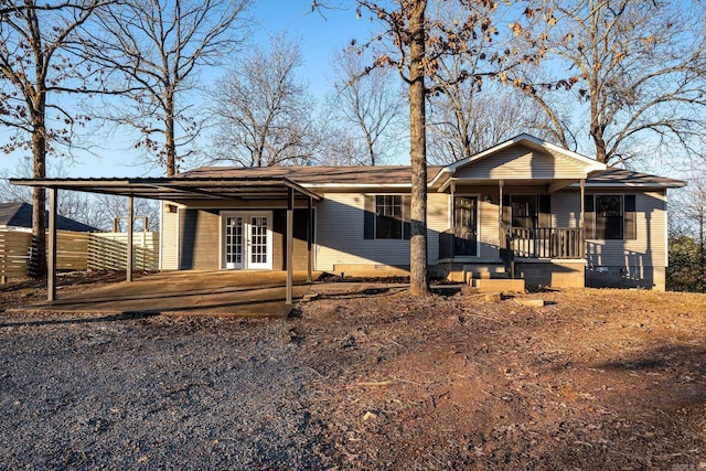 view of front of home featuring french doors and covered porch