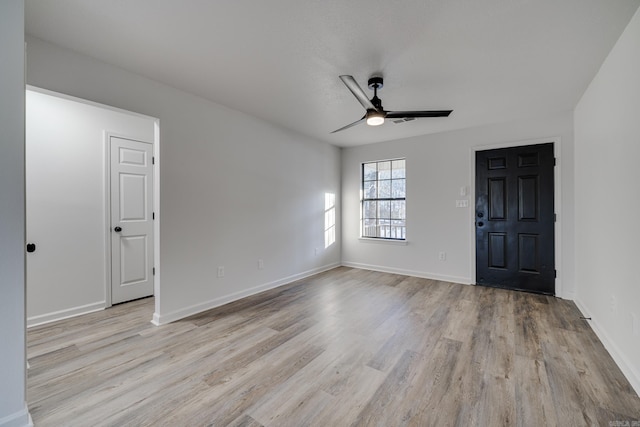 unfurnished room featuring ceiling fan and light wood-type flooring