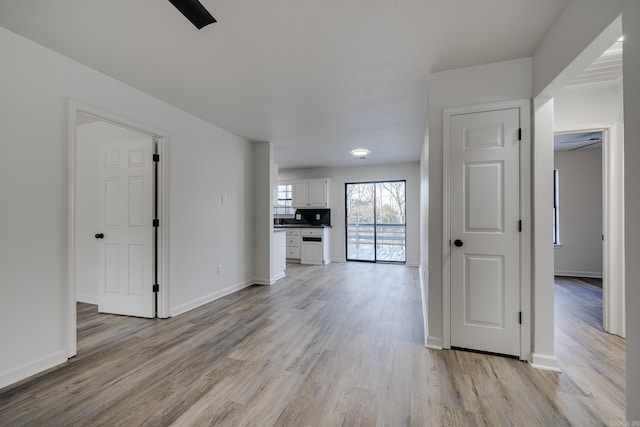 unfurnished living room with light wood-type flooring