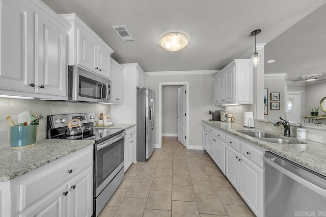 kitchen with stainless steel appliances, sink, white cabinetry, light tile patterned flooring, and crown molding