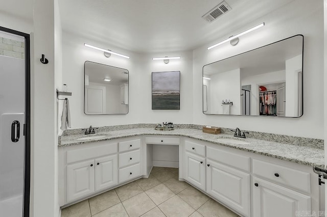 bathroom with vanity and tile patterned flooring