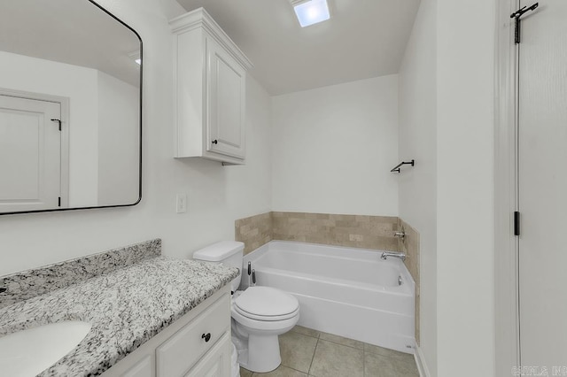 bathroom featuring toilet, a washtub, tile patterned flooring, and vanity