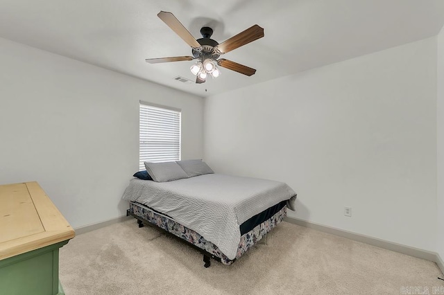 bedroom with ceiling fan and carpet