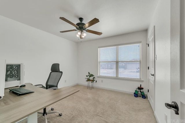 carpeted home office with ceiling fan