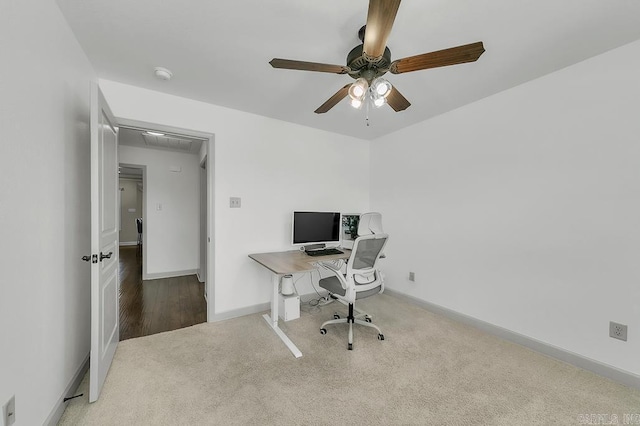 office space featuring ceiling fan and carpet floors