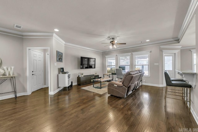 living room featuring dark hardwood / wood-style flooring, ceiling fan, and crown molding