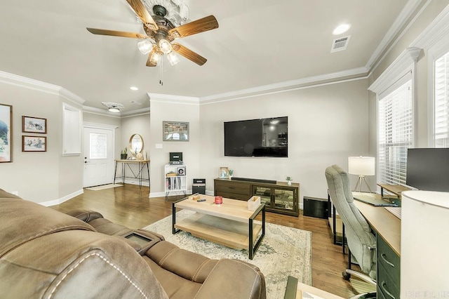 living room with ceiling fan, ornamental molding, and light hardwood / wood-style flooring