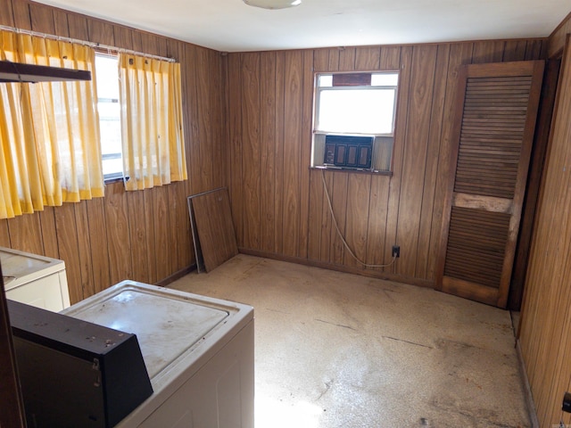 unfurnished room featuring wood walls and cooling unit