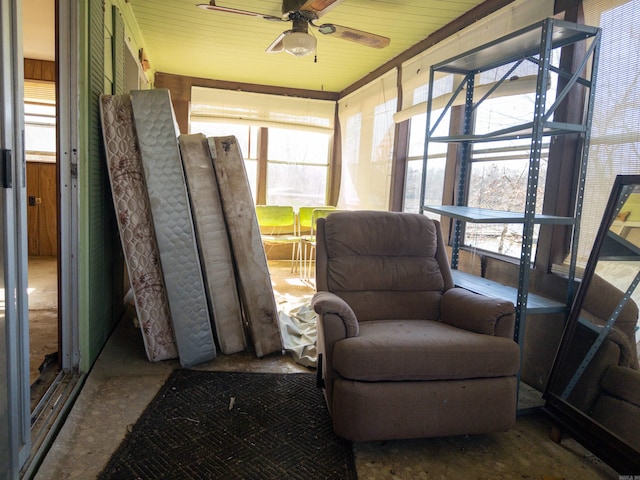 sunroom featuring ceiling fan