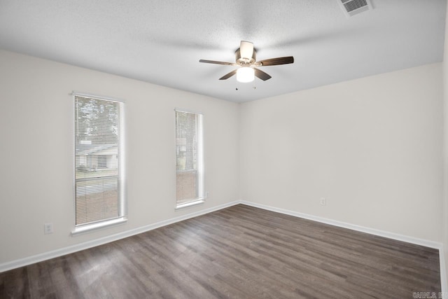 spare room with a textured ceiling and ceiling fan