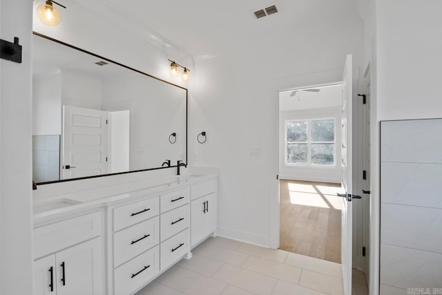 bathroom with tile patterned flooring and vanity