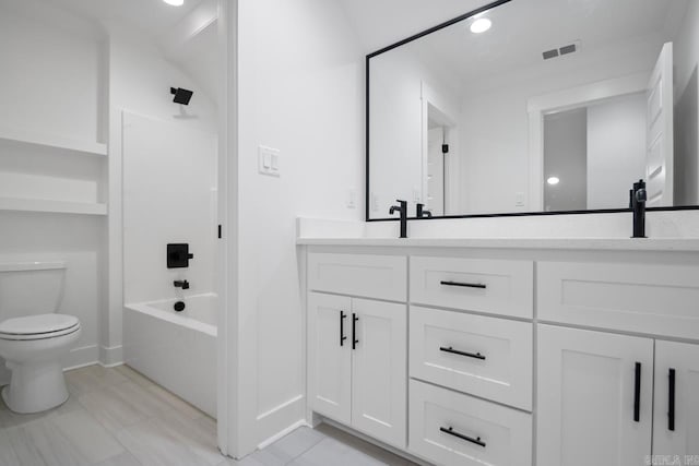 full bathroom featuring toilet, vanity, and tub / shower combination