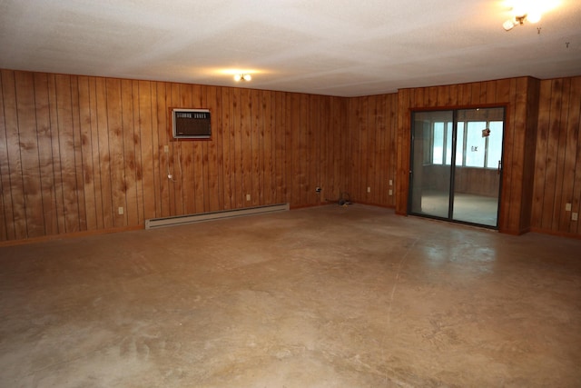 empty room with a wall mounted air conditioner, a baseboard radiator, and wood walls