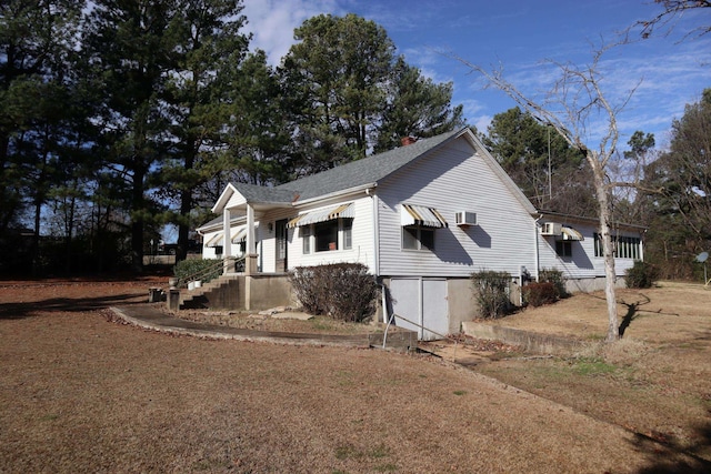 view of side of property with a lawn