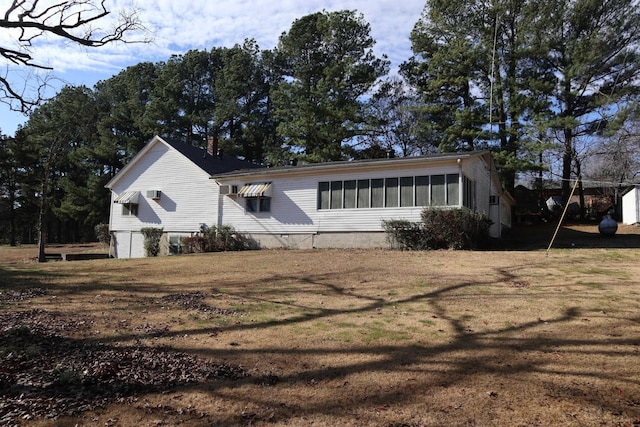 view of home's exterior featuring a lawn