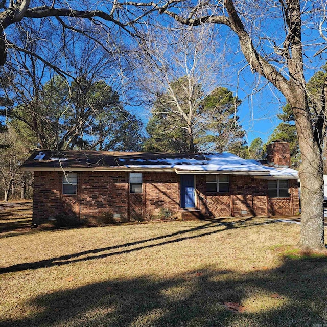 rear view of house with a lawn