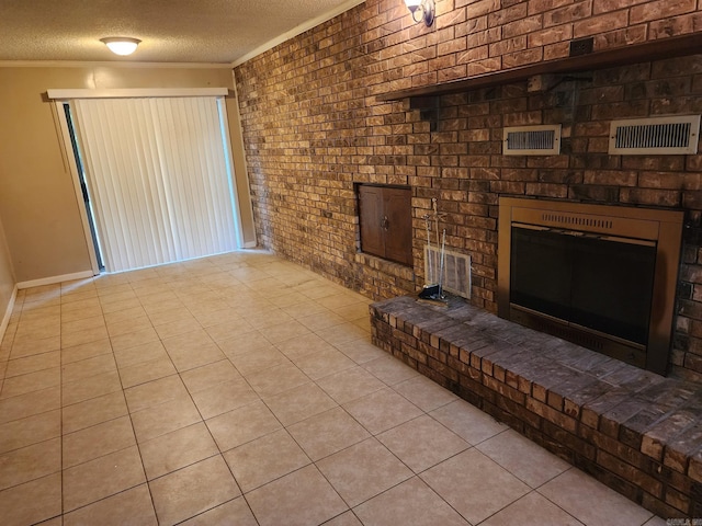 unfurnished living room featuring brick wall, a textured ceiling, light tile patterned flooring, and ornamental molding