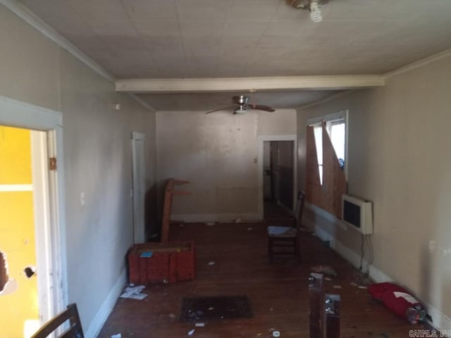 living room featuring dark hardwood / wood-style flooring, ceiling fan, heating unit, and ornamental molding