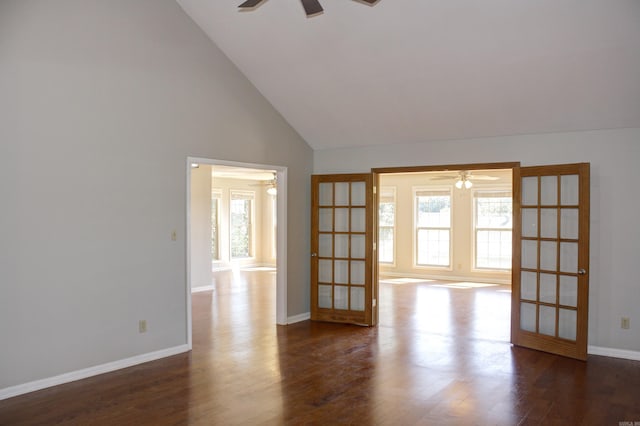 unfurnished room featuring french doors, high vaulted ceiling, and dark wood-type flooring