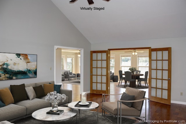 living room with high vaulted ceiling, ceiling fan, french doors, and dark hardwood / wood-style floors