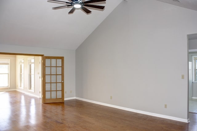 unfurnished living room with high vaulted ceiling, ceiling fan, and wood-type flooring