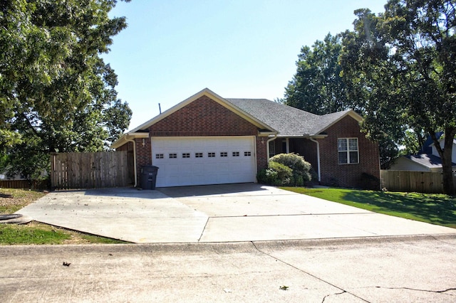 ranch-style home with a front yard and a garage