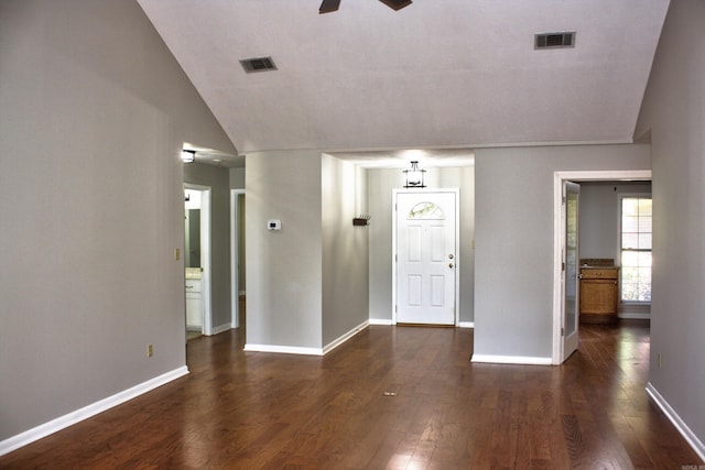 foyer featuring vaulted ceiling and dark hardwood / wood-style floors