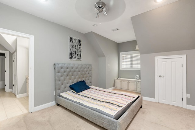 carpeted bedroom with connected bathroom and ceiling fan