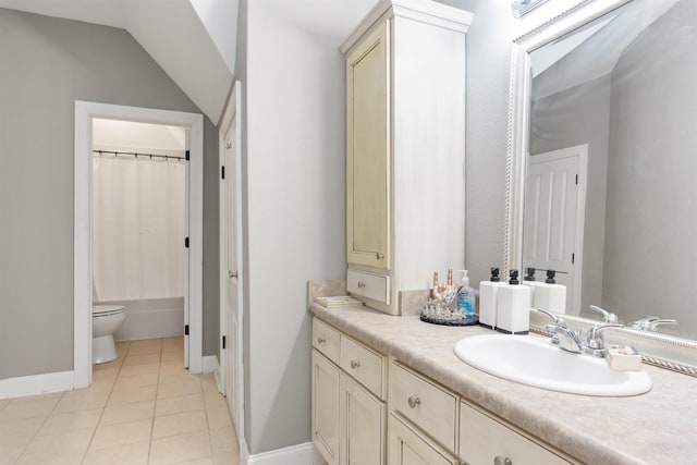 bathroom featuring vanity, tile patterned floors, and toilet