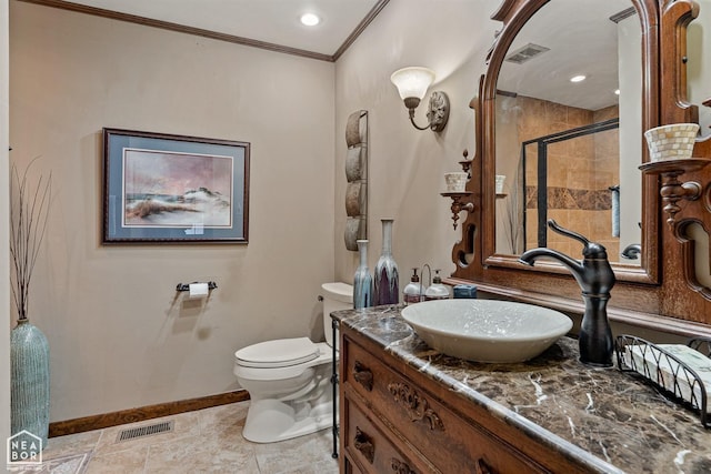 bathroom featuring toilet, a shower with door, crown molding, and vanity