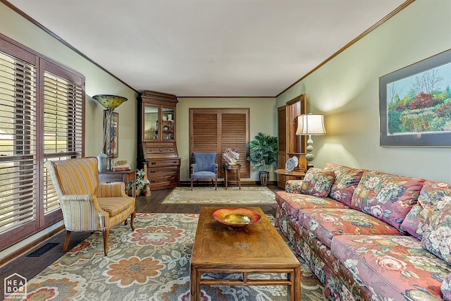 living room with crown molding and hardwood / wood-style flooring