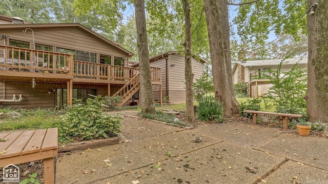 rear view of house featuring a deck