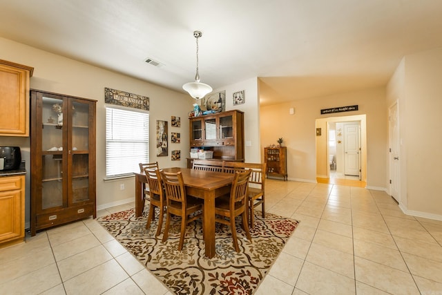 dining room featuring light tile patterned flooring