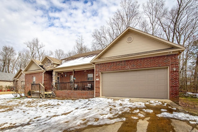 view of front of house with a garage and covered porch