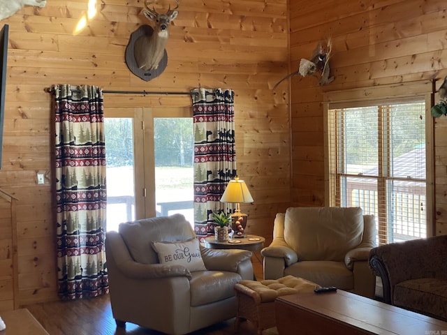 living room featuring wood walls and hardwood / wood-style flooring