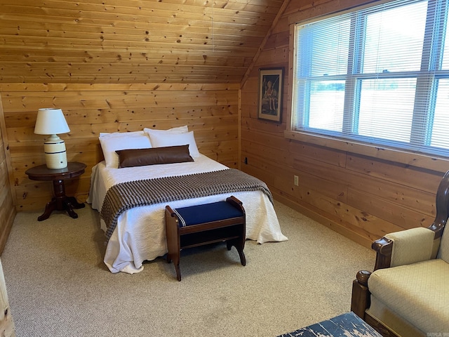 carpeted bedroom featuring vaulted ceiling and wooden walls