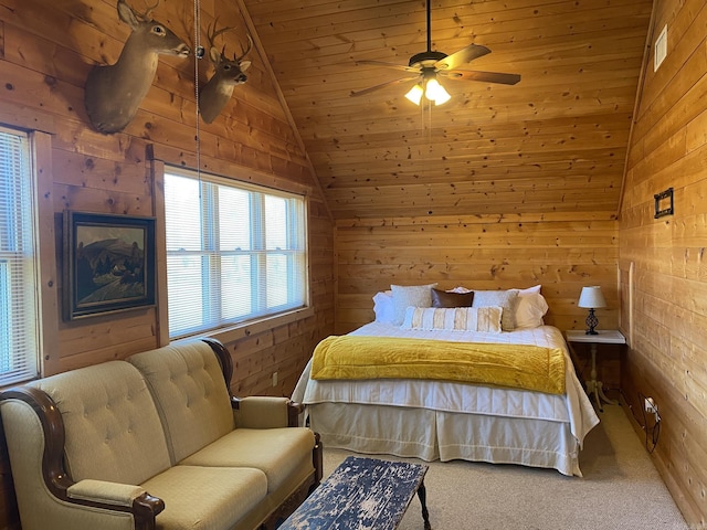 bedroom featuring lofted ceiling, carpet floors, ceiling fan, and wooden walls