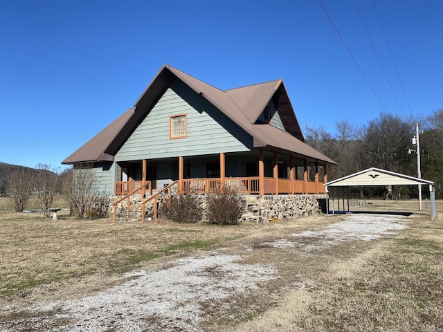 view of front facade with a porch and a carport