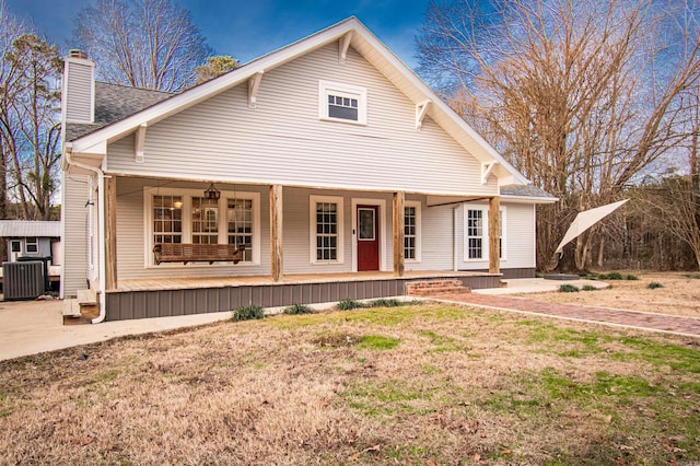 view of front of home with covered porch and central air condition unit