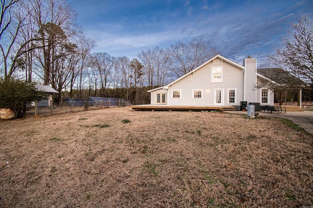 view of home's exterior featuring a yard and a wooden deck