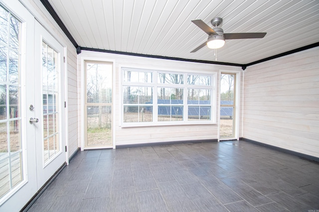 unfurnished sunroom featuring ceiling fan and wooden ceiling