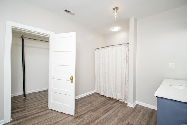 bathroom with vanity and hardwood / wood-style flooring