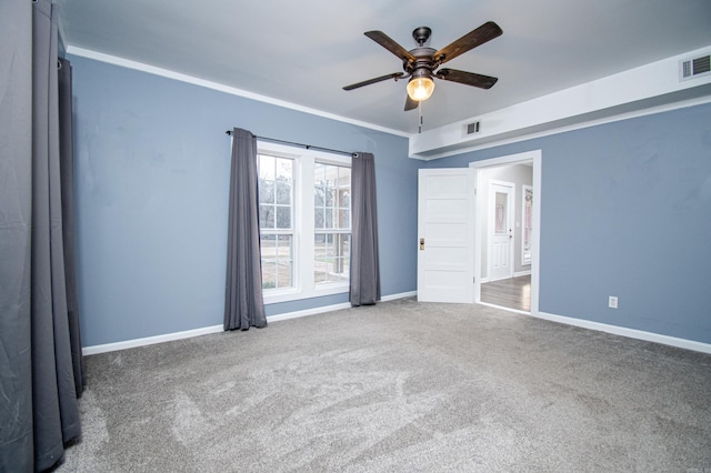 unfurnished room featuring ceiling fan and carpet